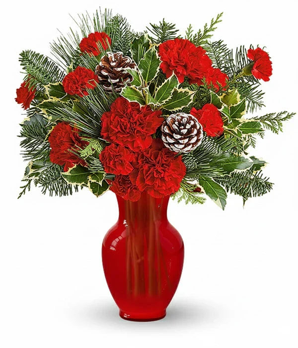 Winter woodland bouquet of red roses, carnations, & pine cones.