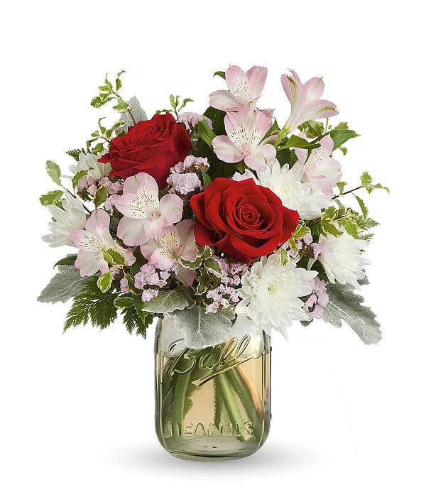 Red roses and flowers in mason jar from florist