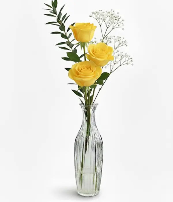 Yellow roses in bud vase from florist